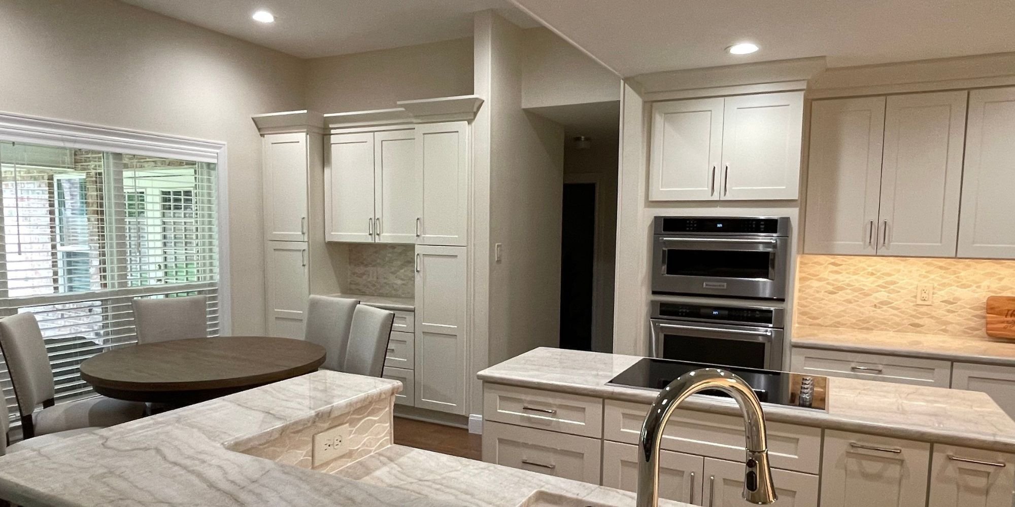 all white kitchen renovation in san antonio with extra storage space